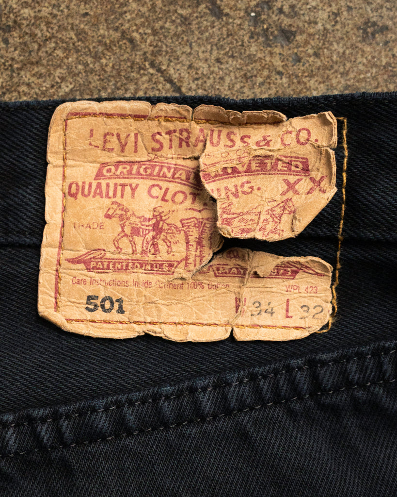 Levi's 501 Faded Blue Black Cropped Jeans - 1990s patch detail photo