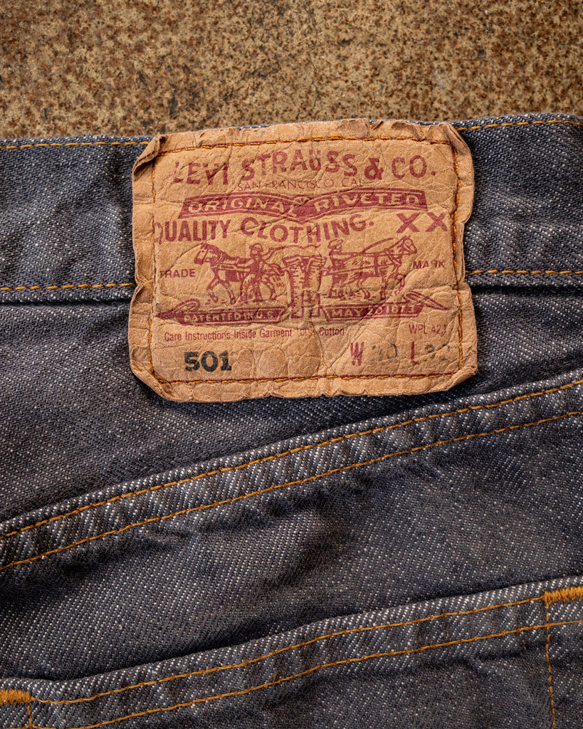 Levi's 501 Faded Indigo Distressed Jeans - 1990s DETAIL PHOTO OF SIZE TAB ON BACK OF JEANS